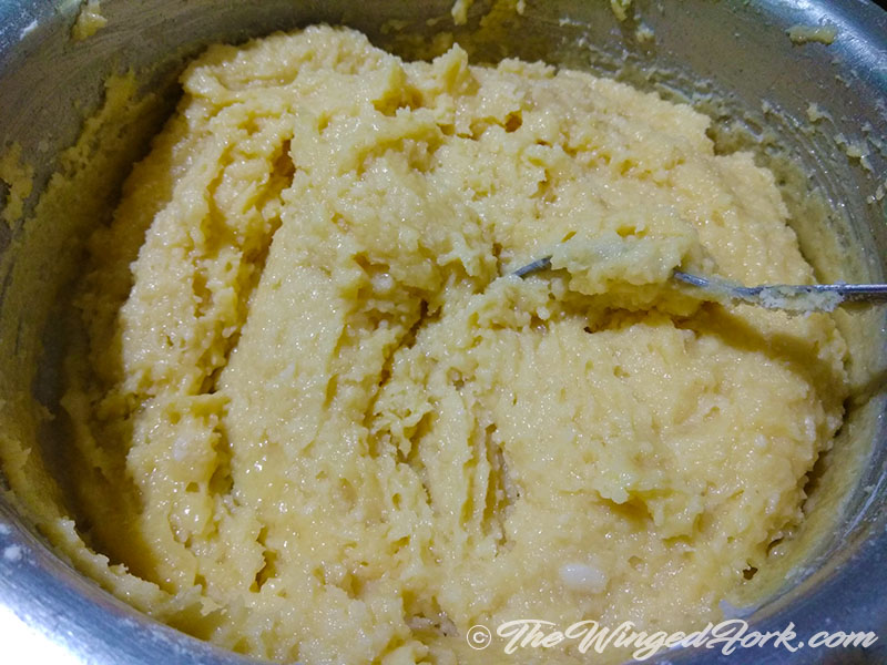 Sojee (semolina), baking powder, grated coconut are added to the  egg, butter, sugar mixture and mixed well - Pic by Sarah from AbbysPlate.