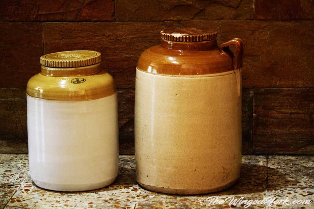 Ceramic jars with wine in them.