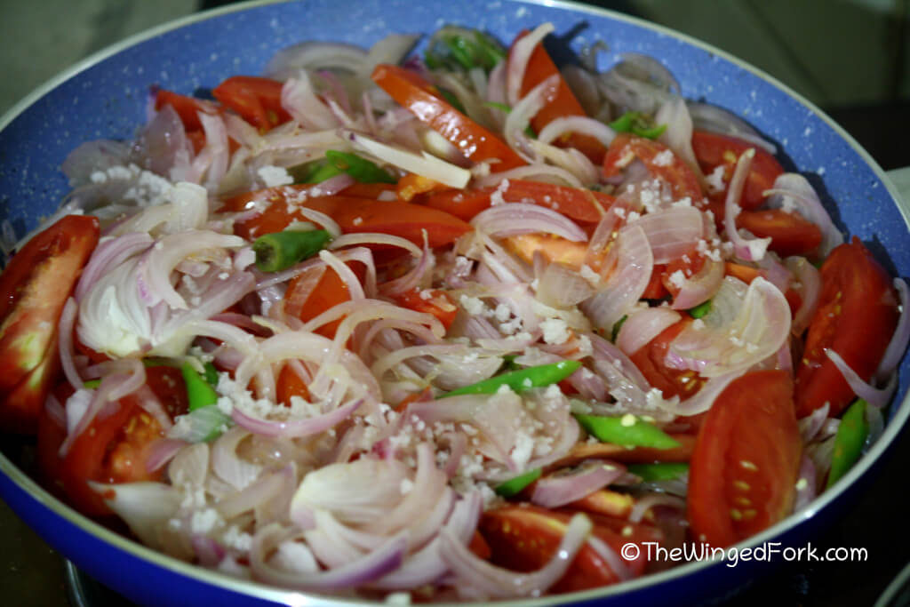 Step 5 - Add in the salt to the chilly fry mix of onions, tomatoes and chillies