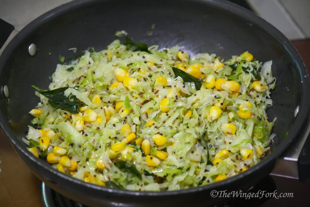 Curry leaves added to the corn and cabbage veggies.