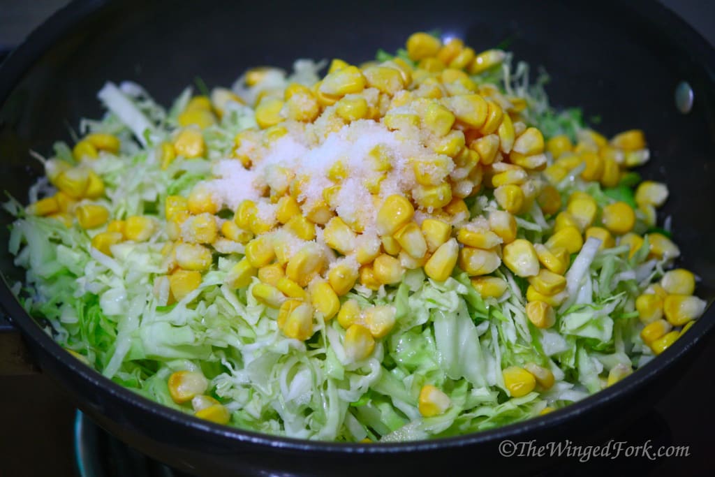 Add salt to the corn and cabbage.