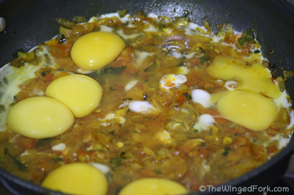 Add eggs to the cooked ingredients and mix together