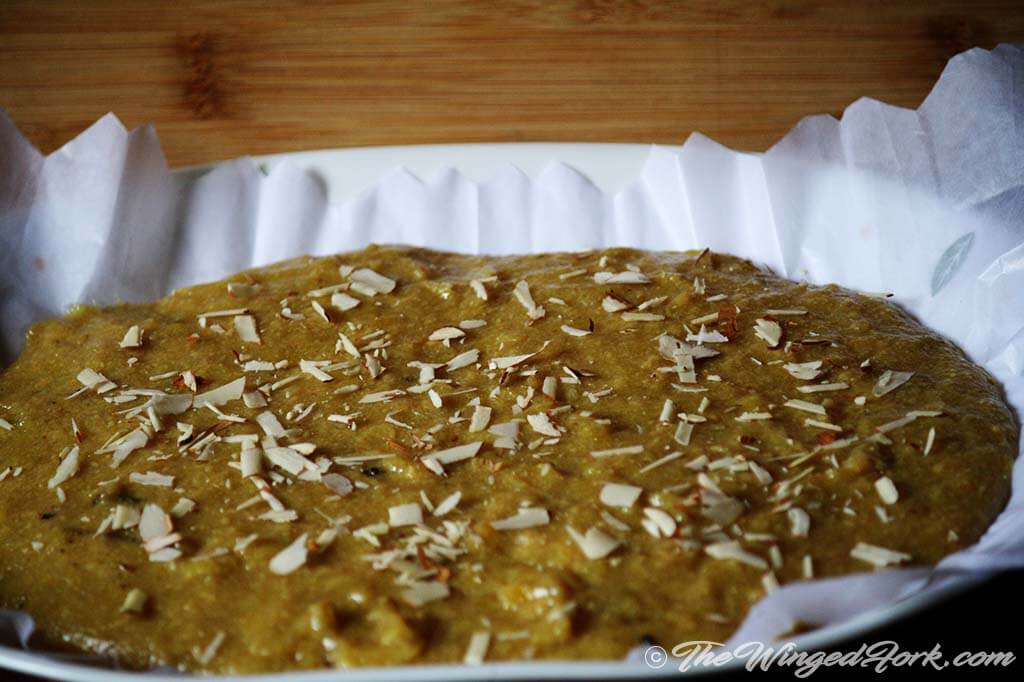 Decorate the burfi with chopped almonds.