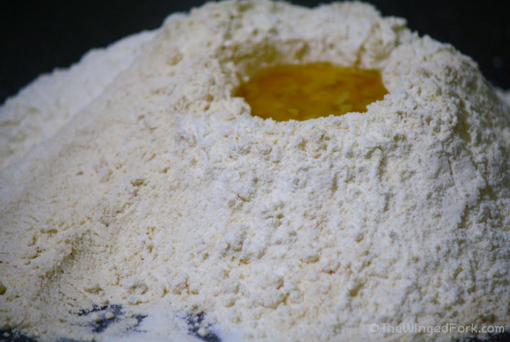 Oil in a well on top of flour.