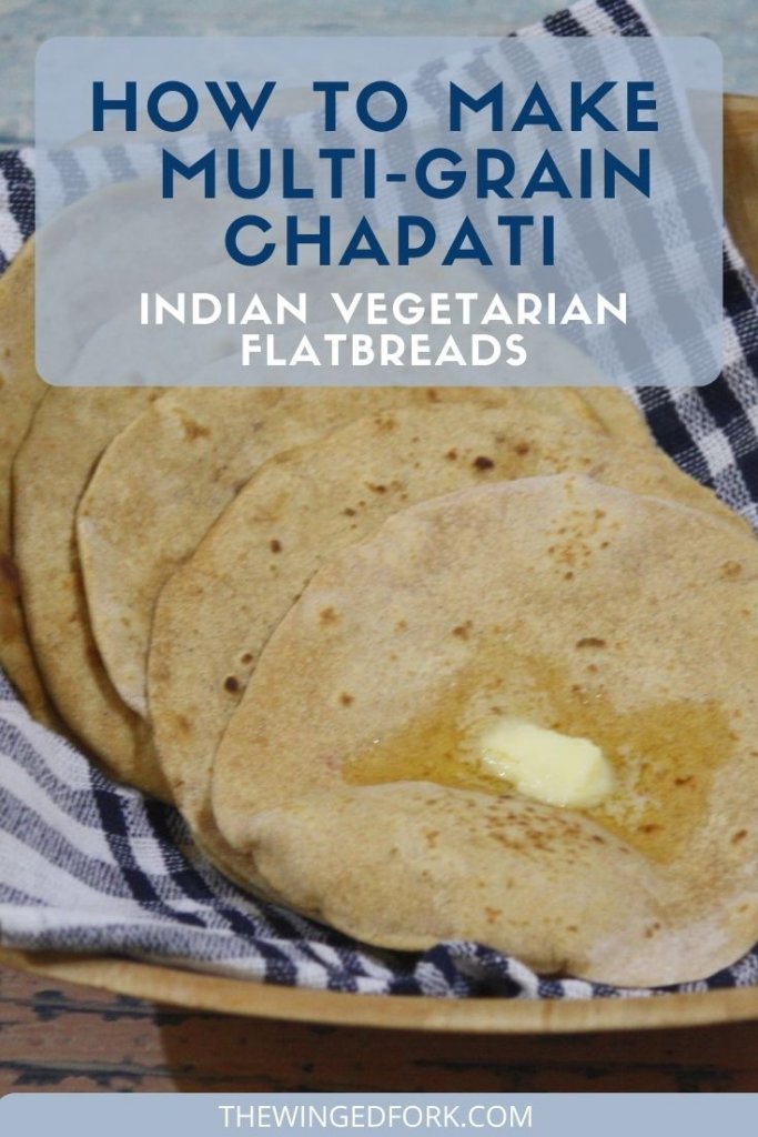 Pinterest image of chappatis on a kitchen towel in a basket with a piece of butter melting on top.
