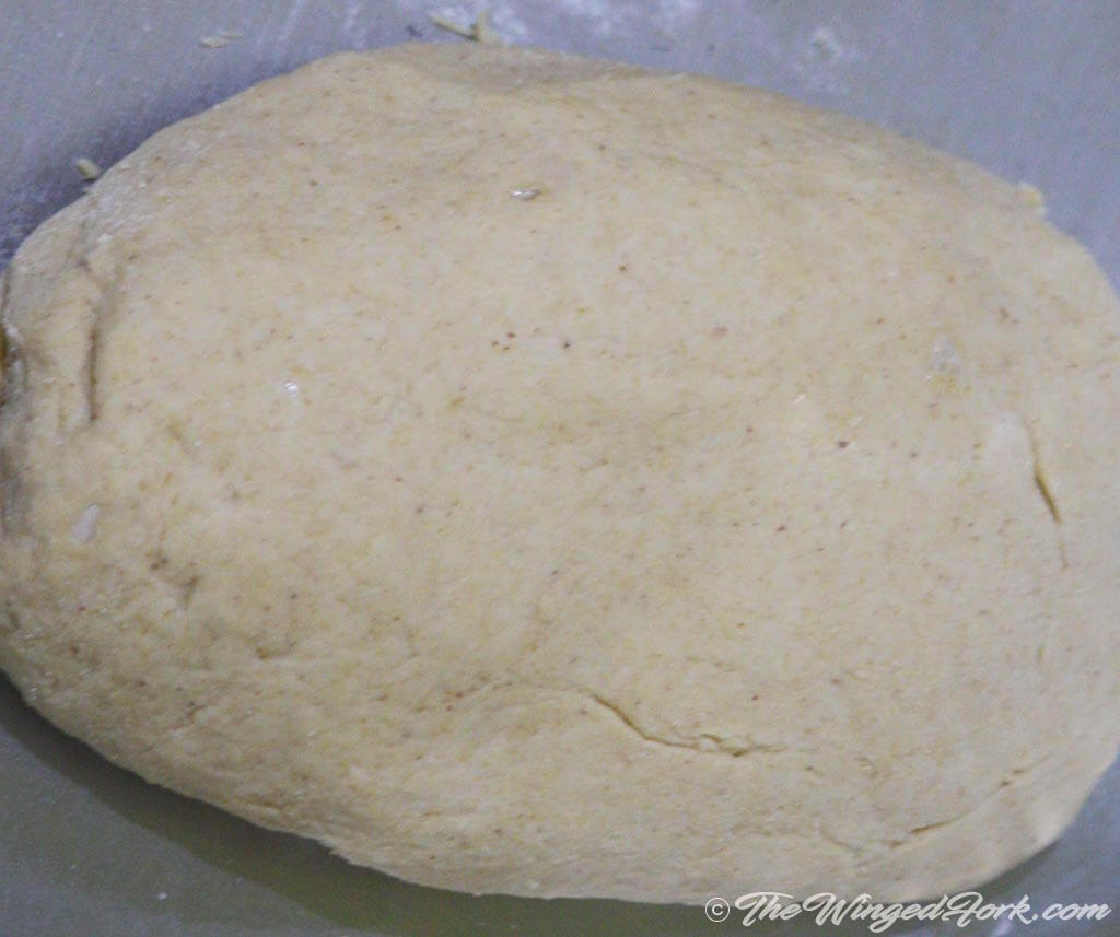 Dough of wholewheat flour in a stainless steel pan.
