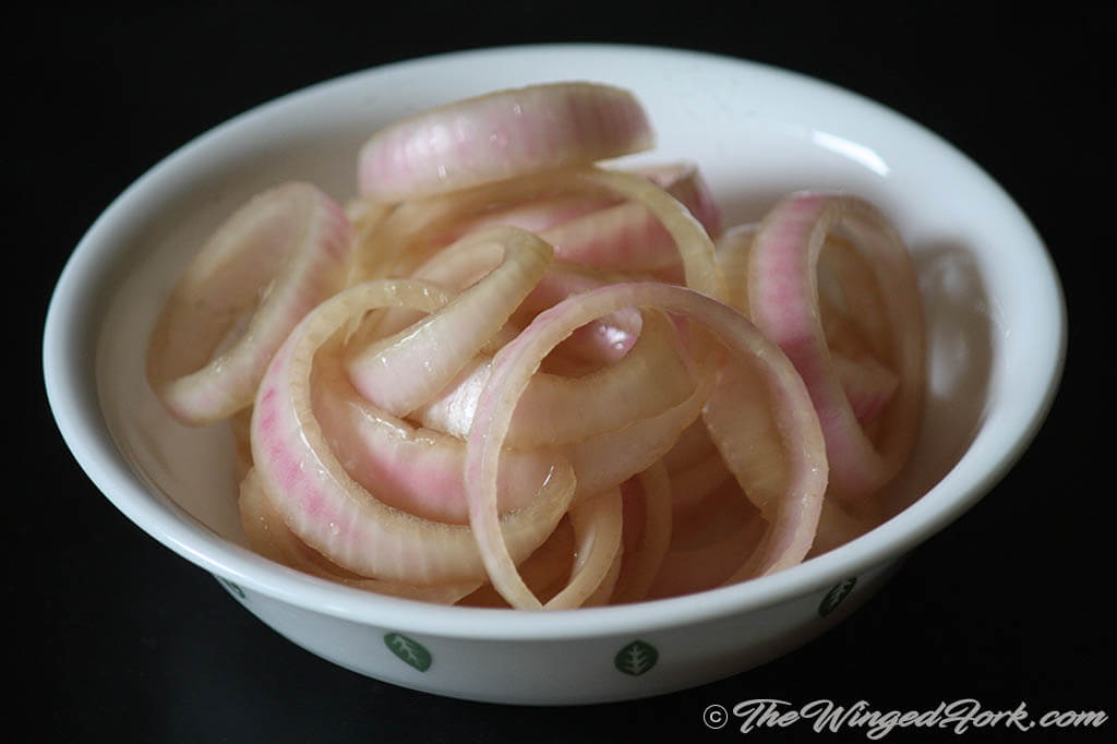 Present the crispy onion sirka in a bowl.