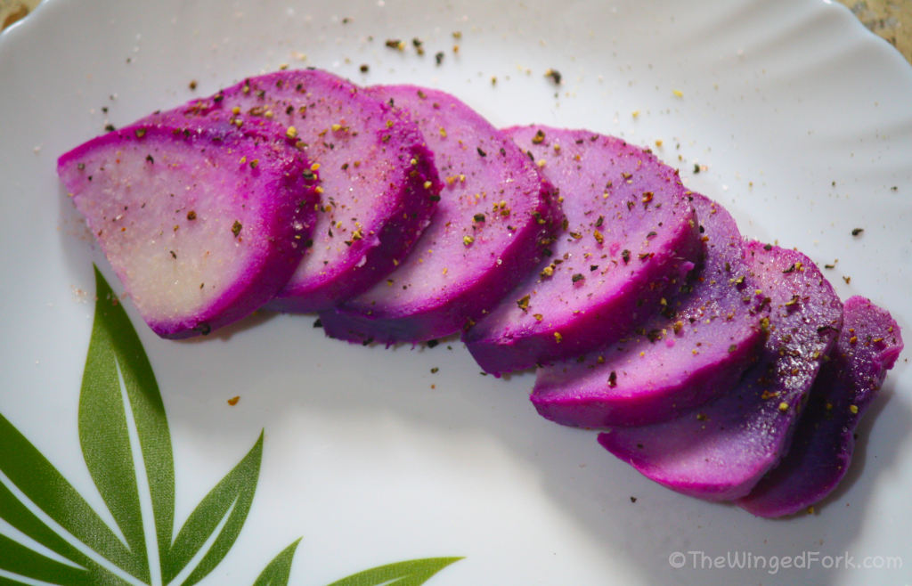 Purple Yam served on a plate with salt and pepper.