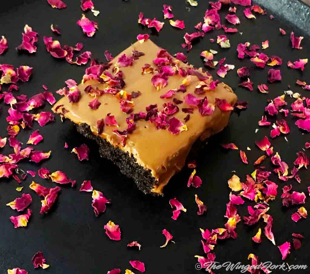 Chocolate brownies with rose petals.