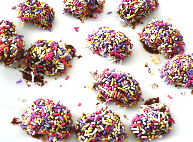 Chocolate eggs coated with sprinkles.