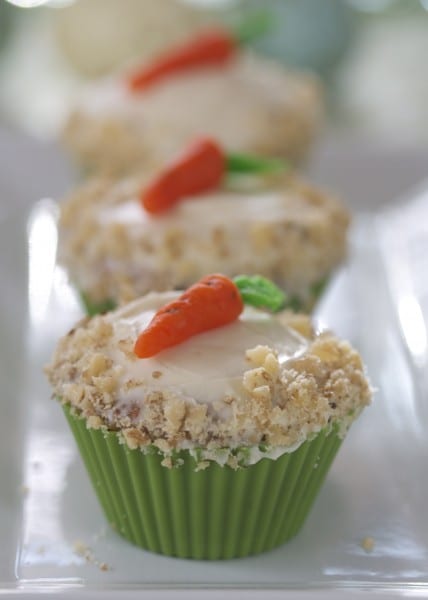 Gluten free carrot cupcakes with a marzipan carrot on top.