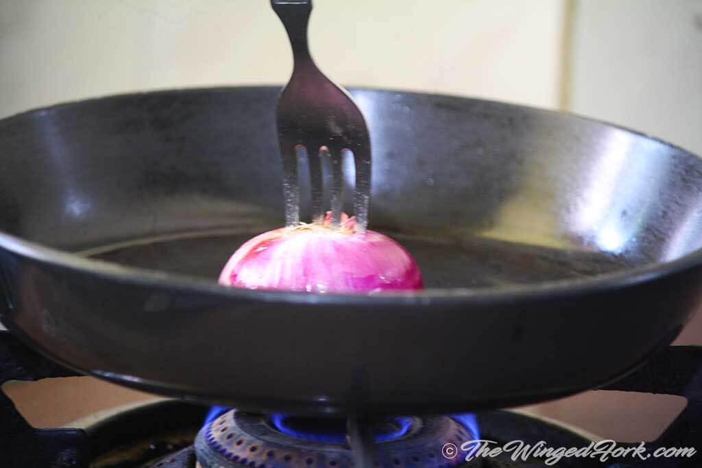 Make the pan hot and add oil and spread it with onion.