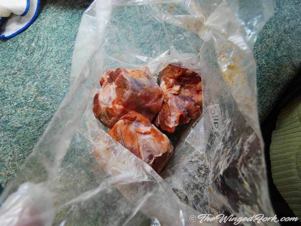 Cut Oxtail pieces in bag.