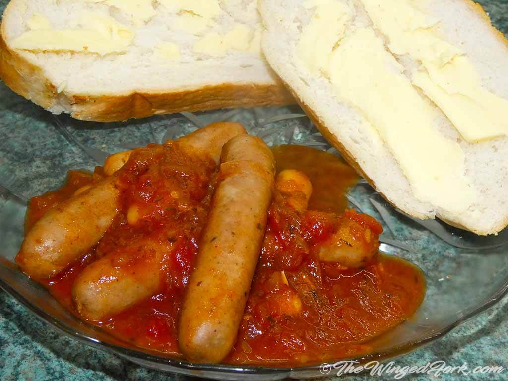 Sausage Casserole next to buttered bread.
