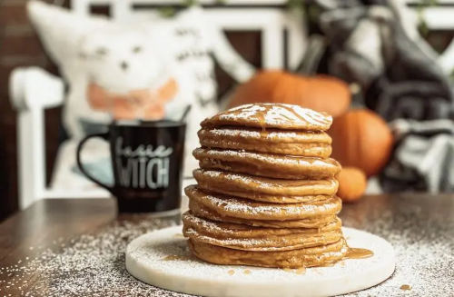 Pumpkin pancakes on top of each other.
