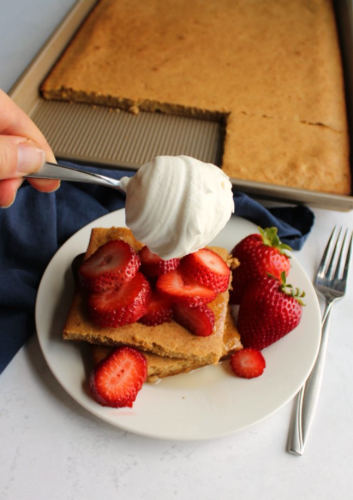 Wholewheat Banana Sheet Pancake served with strawberry and cream.