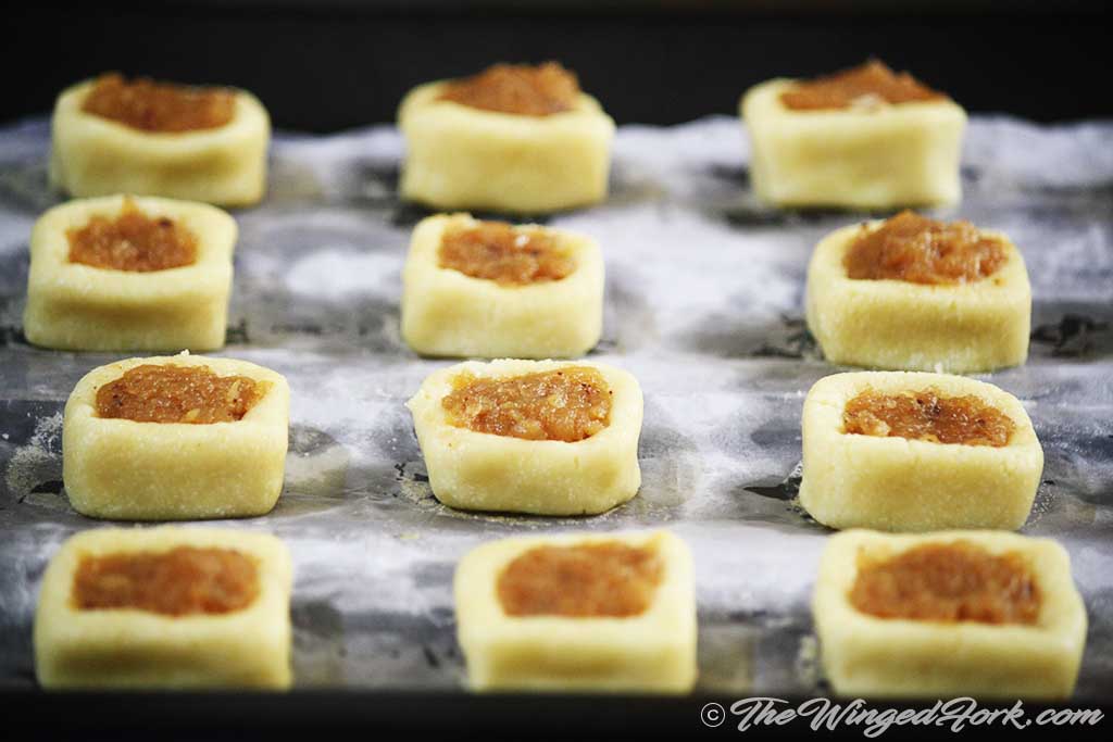 Apple halwa filled in square dough cups to make cookies..