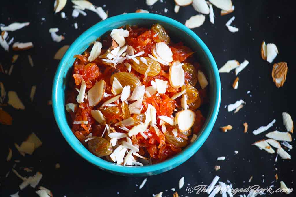 Indian carrot dessert with grated almonds on top.