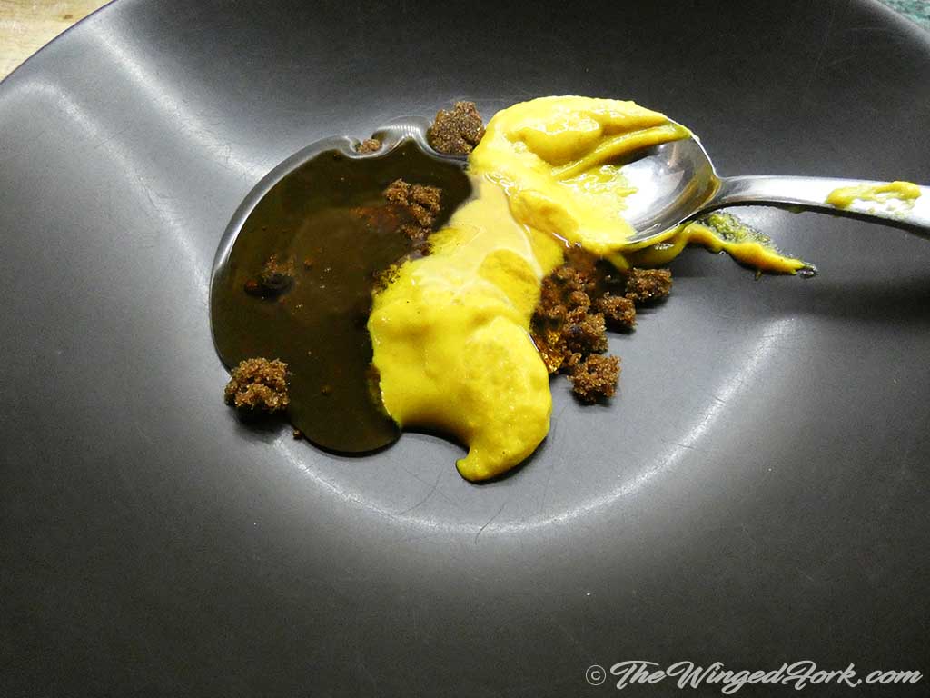 Take mustard, honey, and sugar on a plate with spoon.