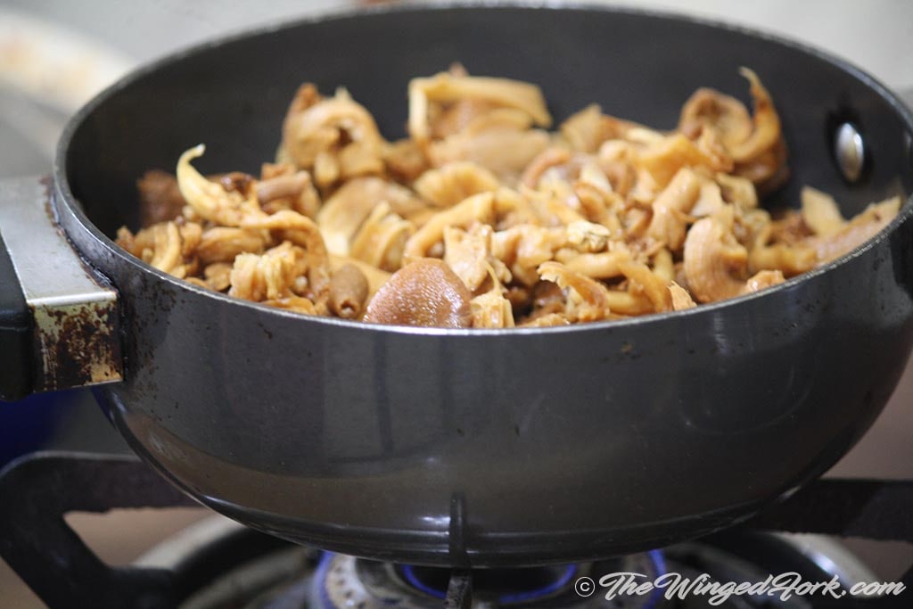 Add mushrooms to the vessel and let it cook.