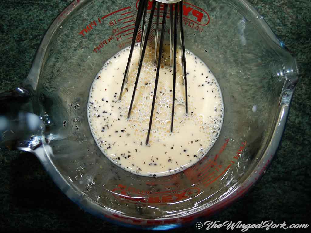 Whisk eggs, milk, salt and pepper mixture in a bowl.