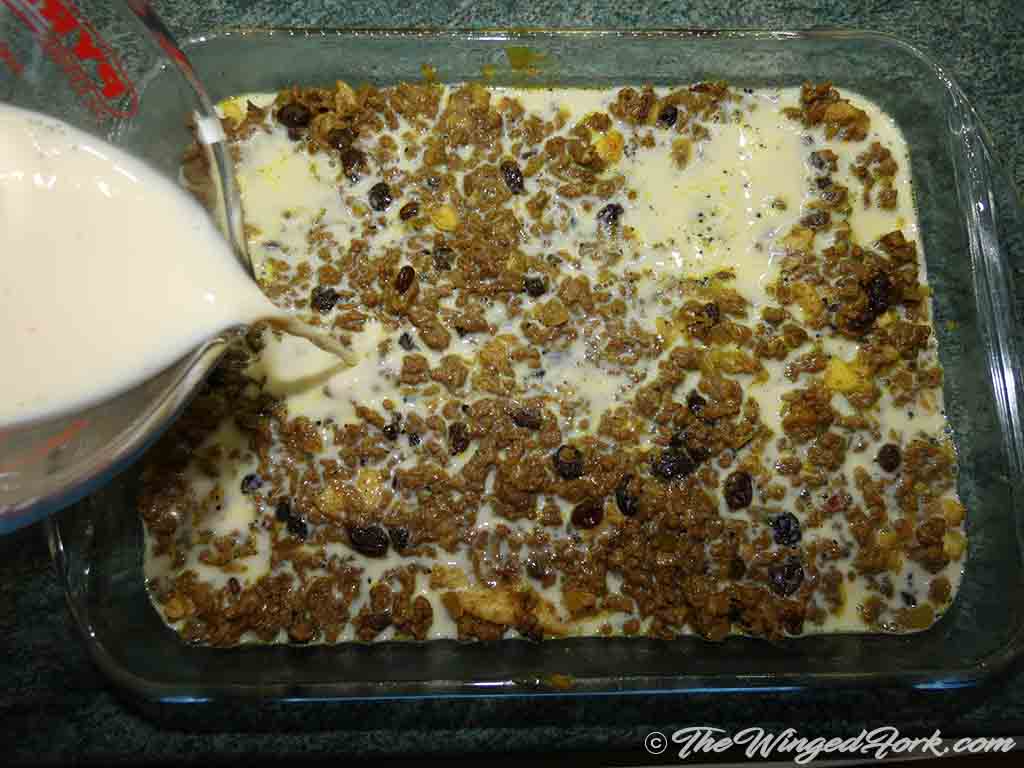Place the cooked mince to a baking tray and pour egg mixture.