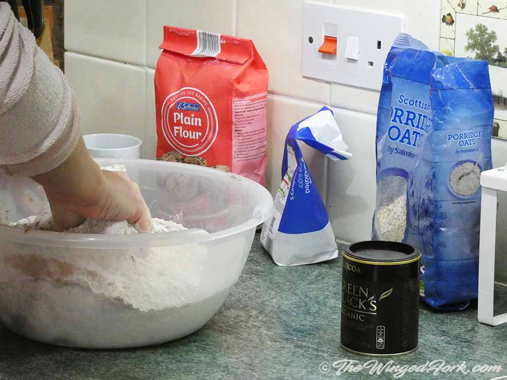 Hand kneading the margarine and flour together.