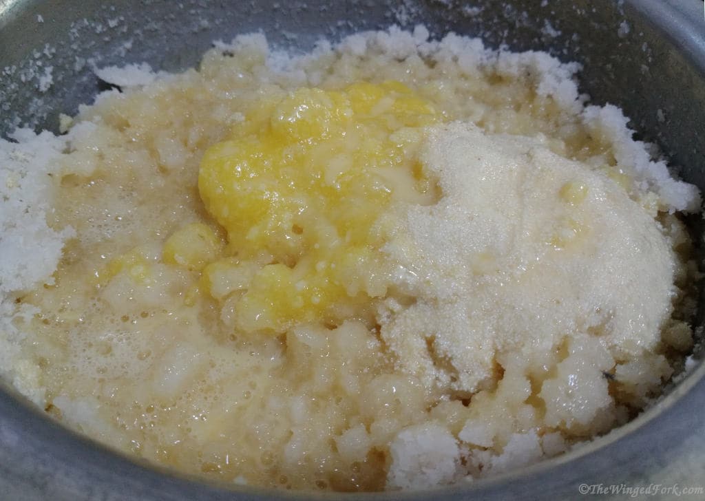 Ghee, sojee and beaten egg added to coconut.