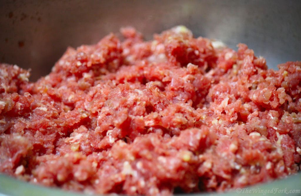 Raw minced beef in a vessel.
