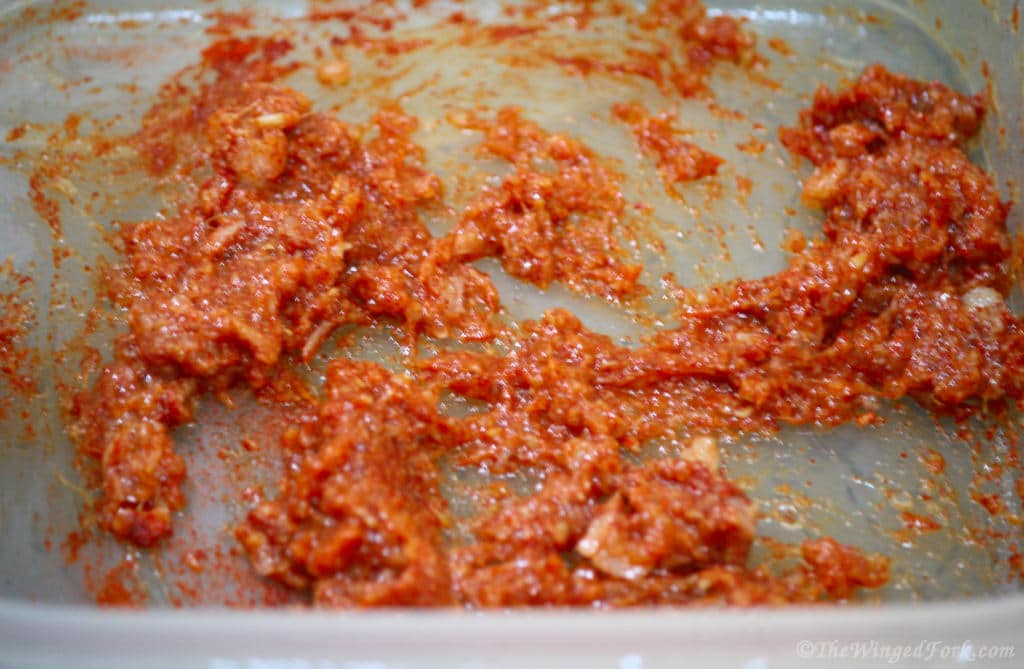 A thick red paste in a vessel.