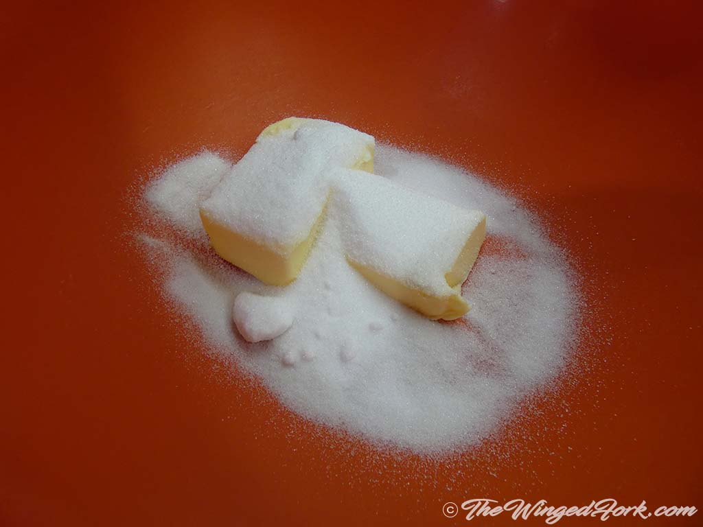 Add sugar to butter in a bowl.