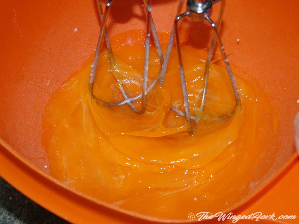 Whisk the egg yolks with a blender.