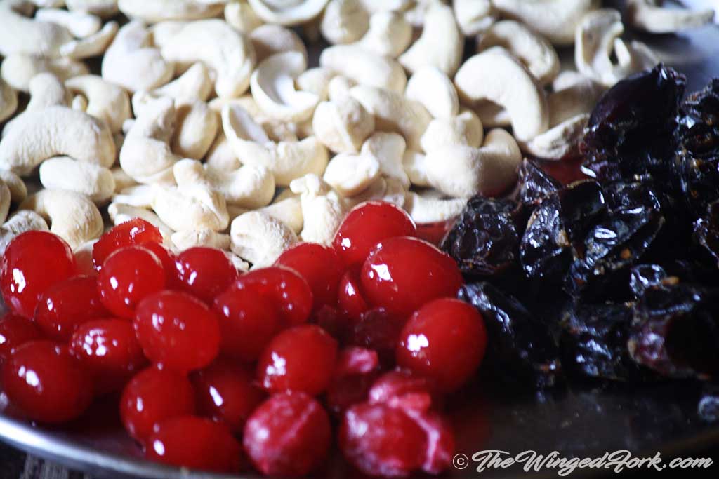 Place cherries, dates and cashews in a plate.