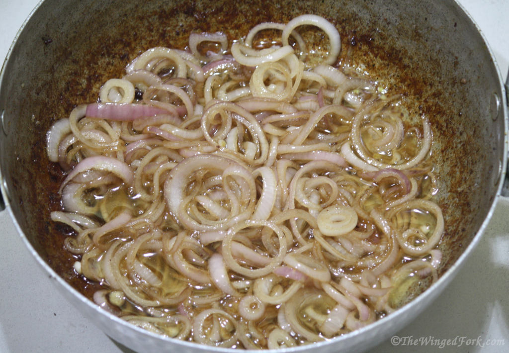 Fried Glassy Onions in a kadai.
