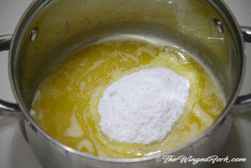 Add sugar to the melted butter.
