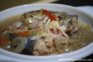 Bagra stew or mackerel chilly fry in a white plate.