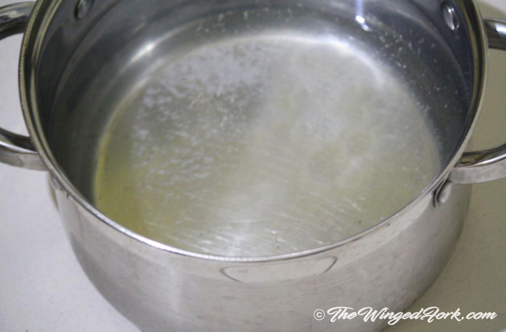 Water and salt boiling in a pot.