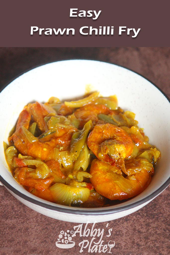 Pinterest image of East Indian prawn chilli fry in a brown kadai.