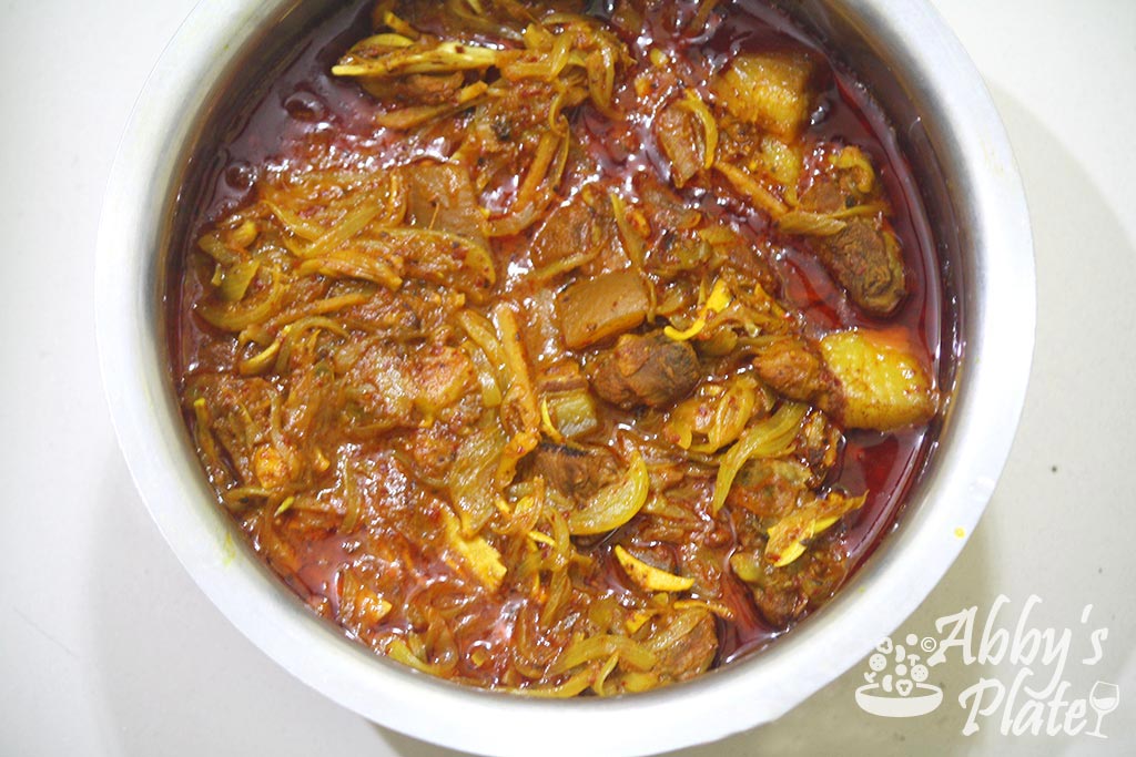 Pork tamriad curry in a large pot.