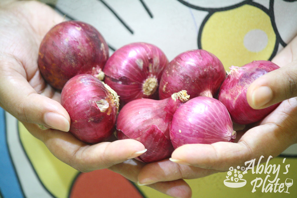 Red onions in my hand.