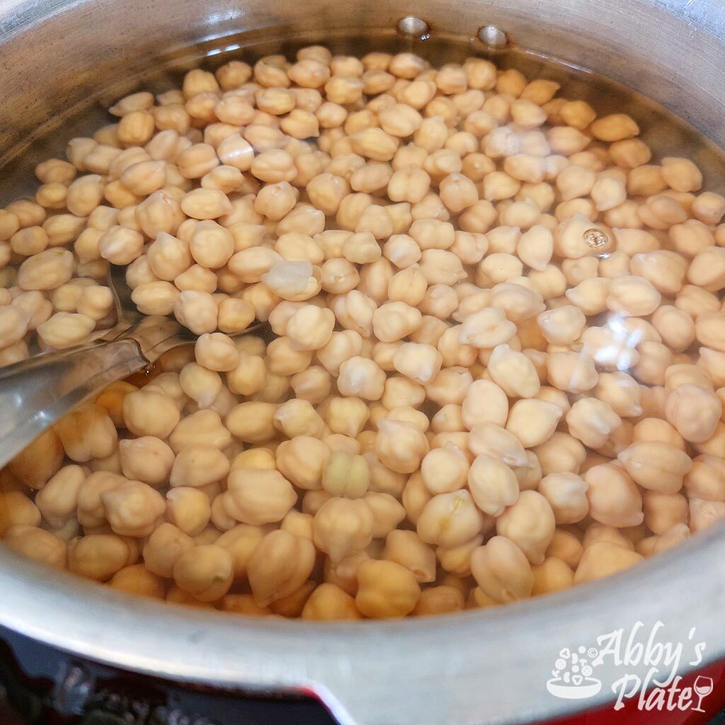 Chickpeas soaking in a pot.