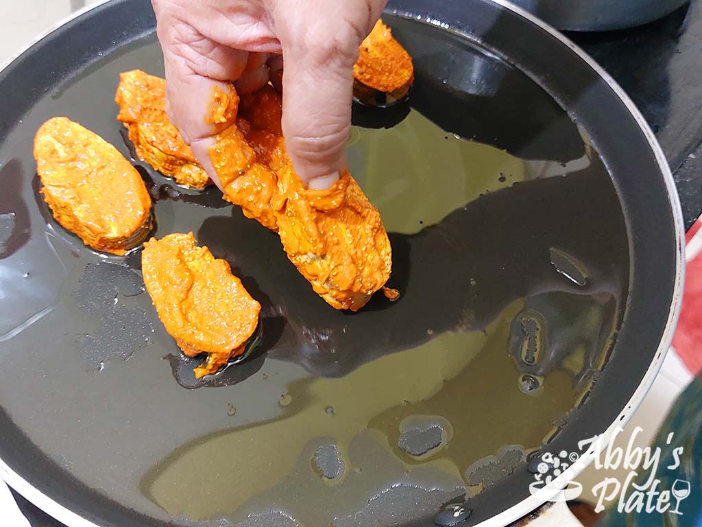 Add the coated roe to the frying pan.