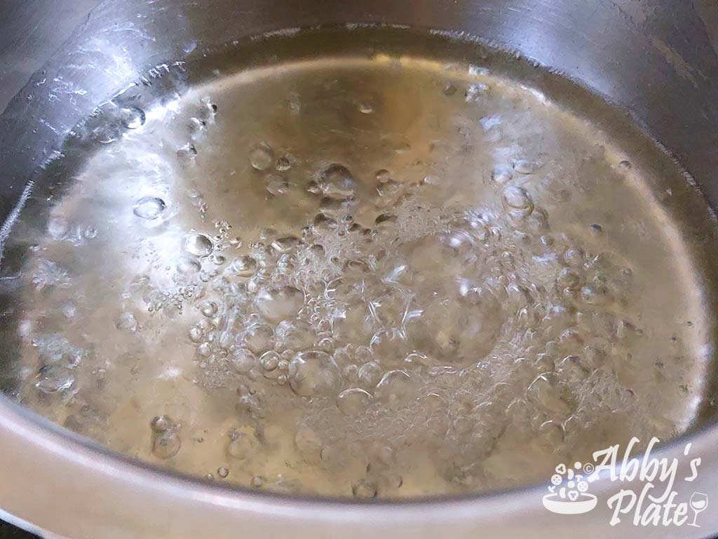 Boiling water with salt.