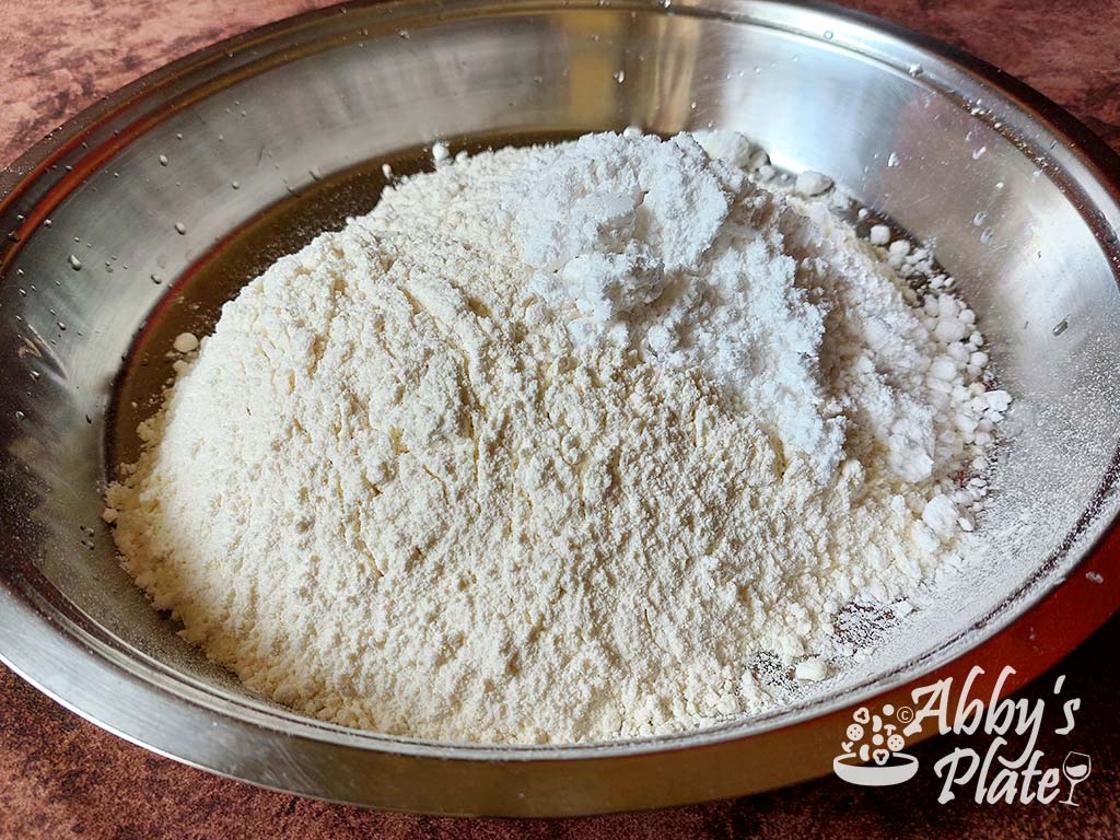 Flour and powdered sugar in a steel thali.